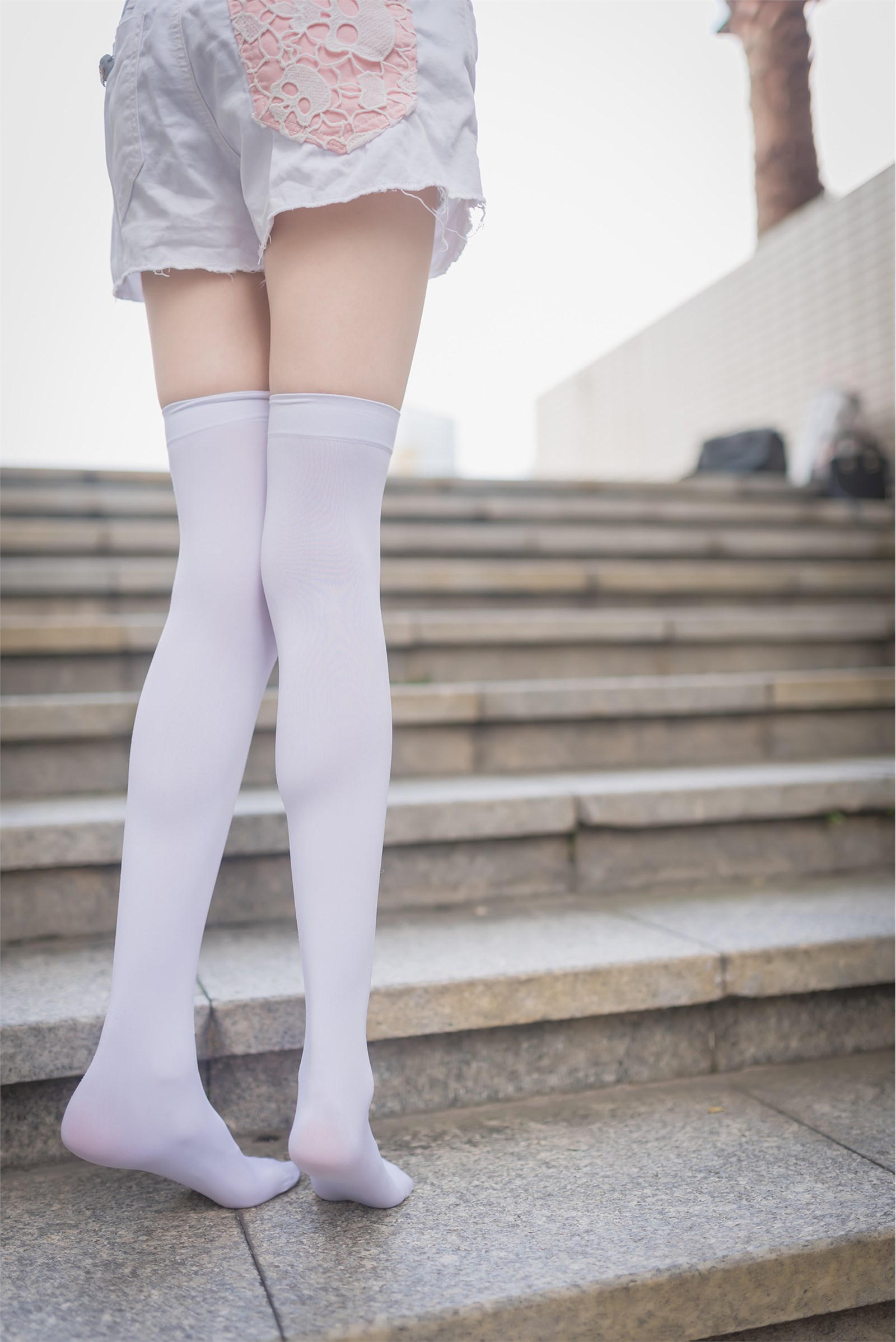 Rabbit plays with painted white stockings over the knee(14)
